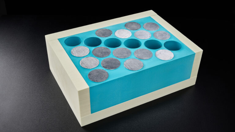 Covestro develops advanced flame-retardant encapsulation foam for EV batteries Covestro's Baysafe BEF (blue foam) depicted against a black background