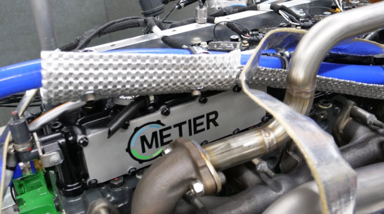 Part of the diesel-to-hydrogen engine conversion technology, with Metier company name and logo written on the side