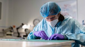 A member of Anaphite's Cells and Electrodes team prepares cells made with DCP for testing