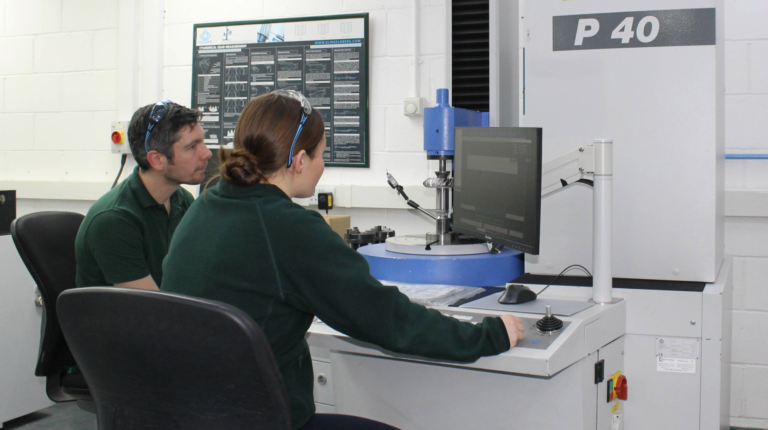Martin Carrick and Teagan Kell working at Klingelnberg P40 measuring equipment