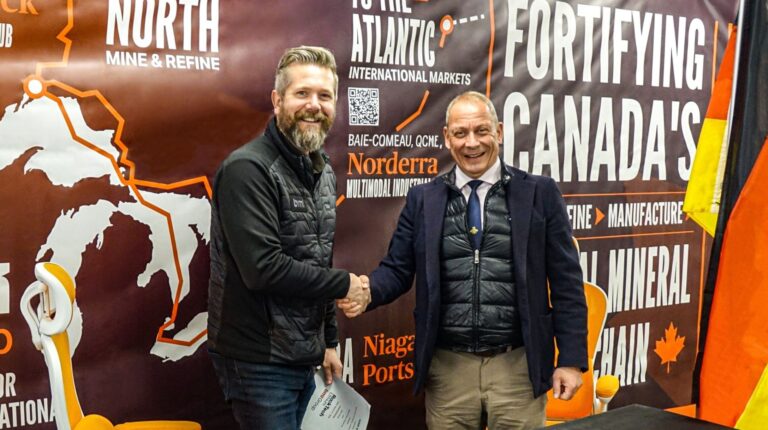 Dirk Harbecke, chair Rock Tech, and Paul Veldman, CEO of BMI Group, shake hands at the signing of the partnership.