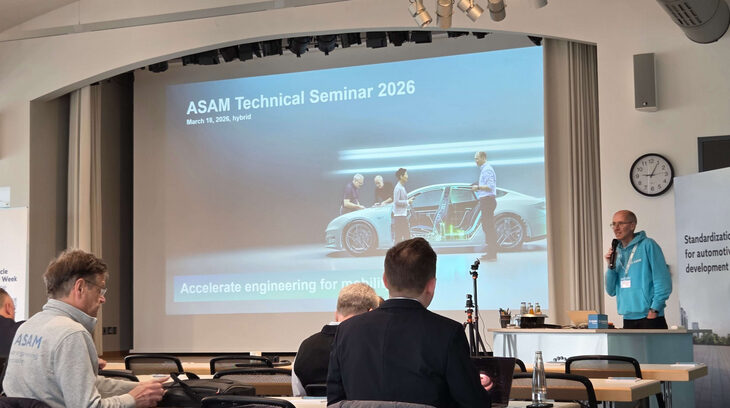 Interoperability and cross‑domain collaboration take center stage at ASAM’s Technical Seminar 2026 People sit in rows at a technical seminar with a speaker on the stage holding a microphone in front of a large projector screen.
