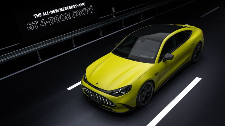 Mercedes‑AMG presents all-electric GT 4‑Door Coupe A yellow Mercedes AMG GT 4 Door Coupe drives along a CG urban street.