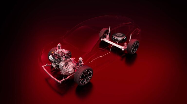 Graphic showing the powertrain of the new Renault Clio with the rest of the vehicle faded out, against a red background.