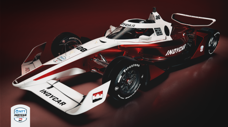 IndyCar unveils all-new IR-28 race car Promo pic of the new IndyCar IR-28 race car, against a black and red background.